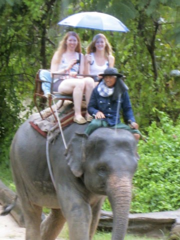Riding elephants in the rain